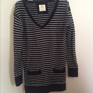 Navy and white striped v neck sweater.